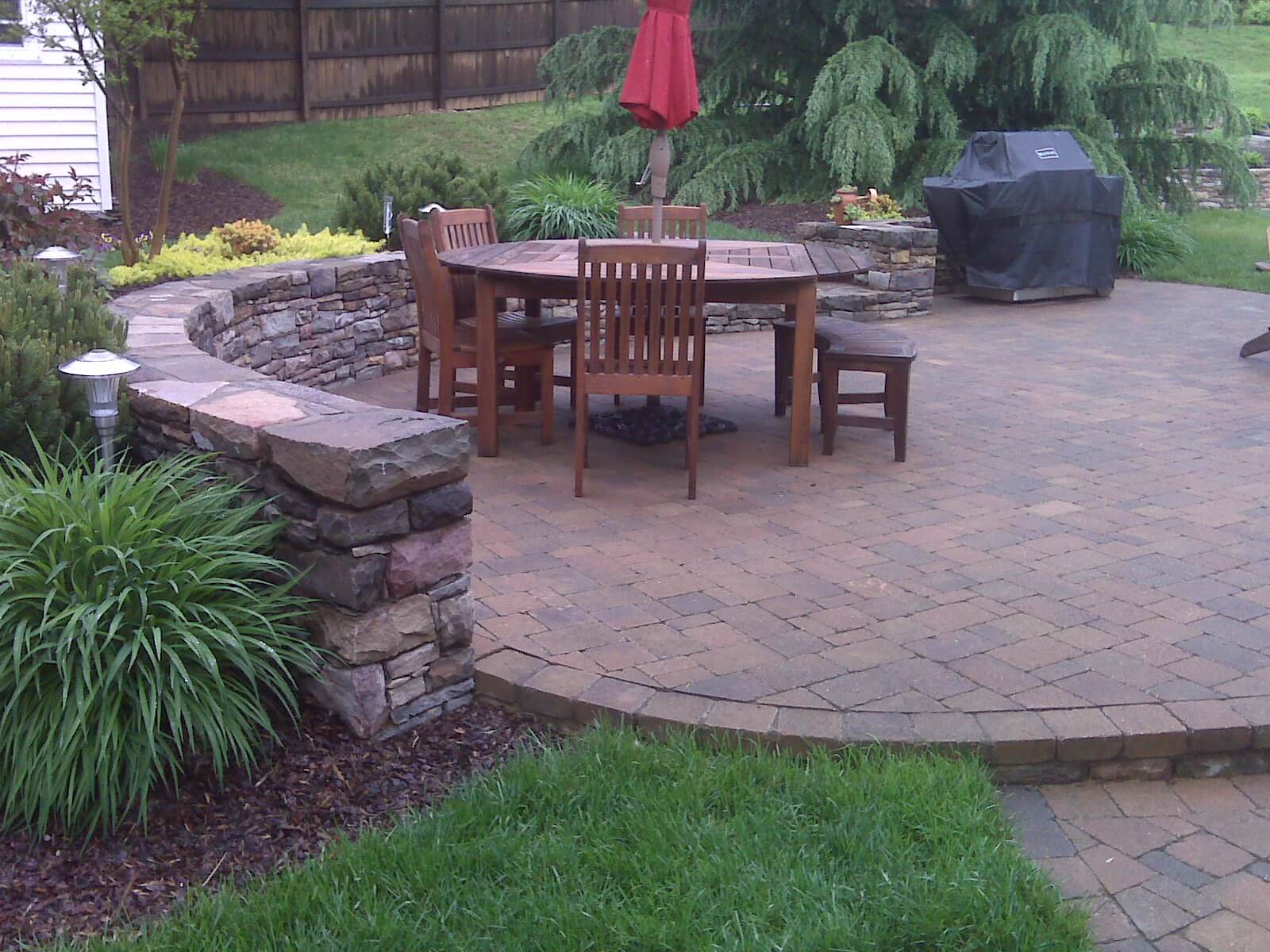 239 Circular Paver Patio and Double-Sided Stone Garden and Retaining Wall