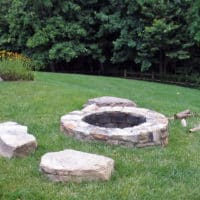 260 Stone Firepit Set Into Lawn with Sitting Boulders