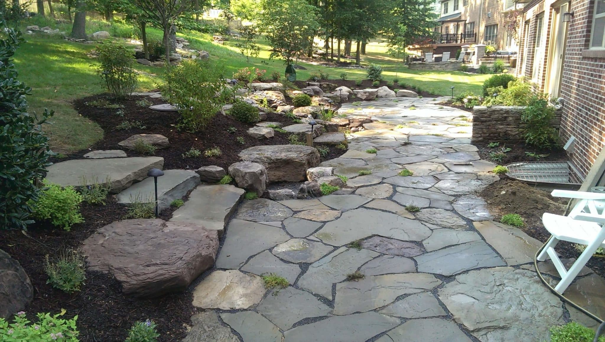 372 Informal Loosely-Laid Flagstone Patio with Boulders and Water Feature