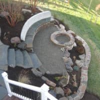 386 View from Deck of Stone Firepit and Custom Built-In Bench and Retaining Wall