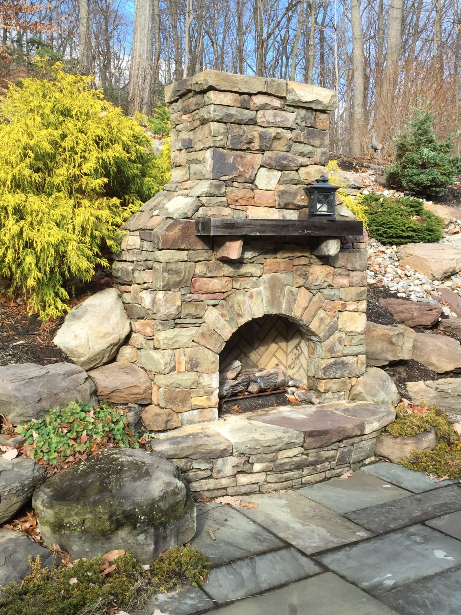 432 Stone Fireplace with Raised Stone Hearth Set Into Hillside