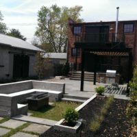 438 Urban Entertaining Space with Flagstone Patio, Custom Steel Pergola and Built-In Benches with Gas Fire Pit