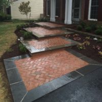 468 Front Brick Walkway Laid in Herringbone Pattern with Flagstone Border and Low Stone Garden Wall