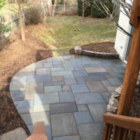 531 View from Deck of Lower-Level Flagstone Patio and Stone Garden Walls