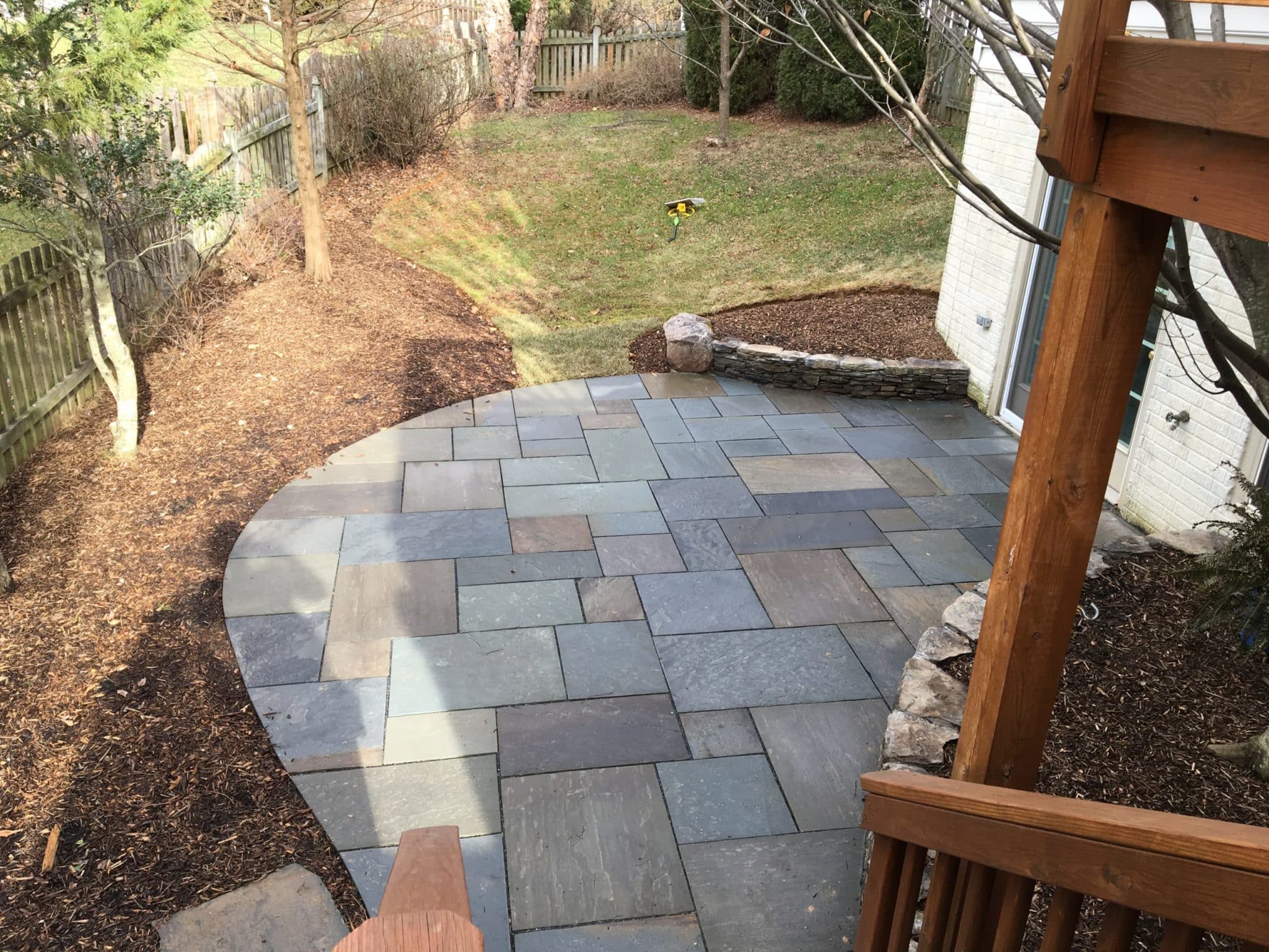 531 View from Deck of Lower-Level Flagstone Patio and Stone Garden Walls