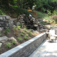 59 Stone Retaining Walls with Cap and Waterfall Built into Hillside
