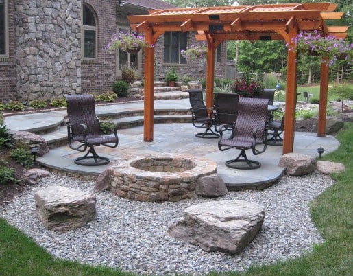 76 Round Stone Firepit at Edge of Flagstone Patio with Boulder Seats