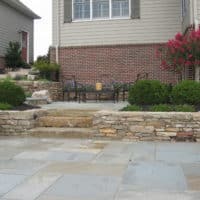 Formal Flagstone Patio with Stone Walls, Built In Grill, Boulders and Potager Garden 5