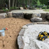 Flagstone Patio, Natural Sand Box and Gravel Pit Play Space