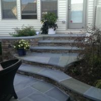 Stone and Flagstone Steps with Integrated Stone Walls