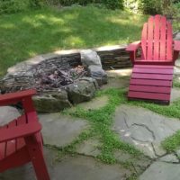 Loosely Laid Flagstone Patio with Stone Retaining Wall and Firepit