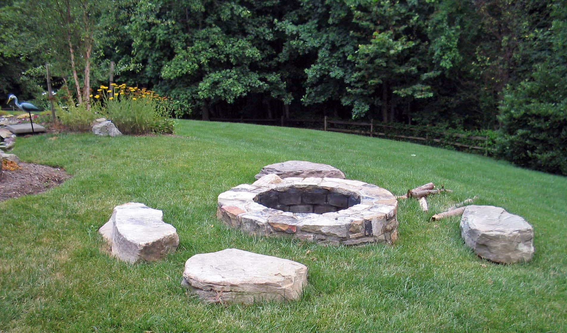 260 Stone Firepit Set Into Lawn with Sitting Boulders