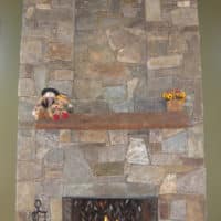 268 Two Story Stone Fireplace with Timber Mantle