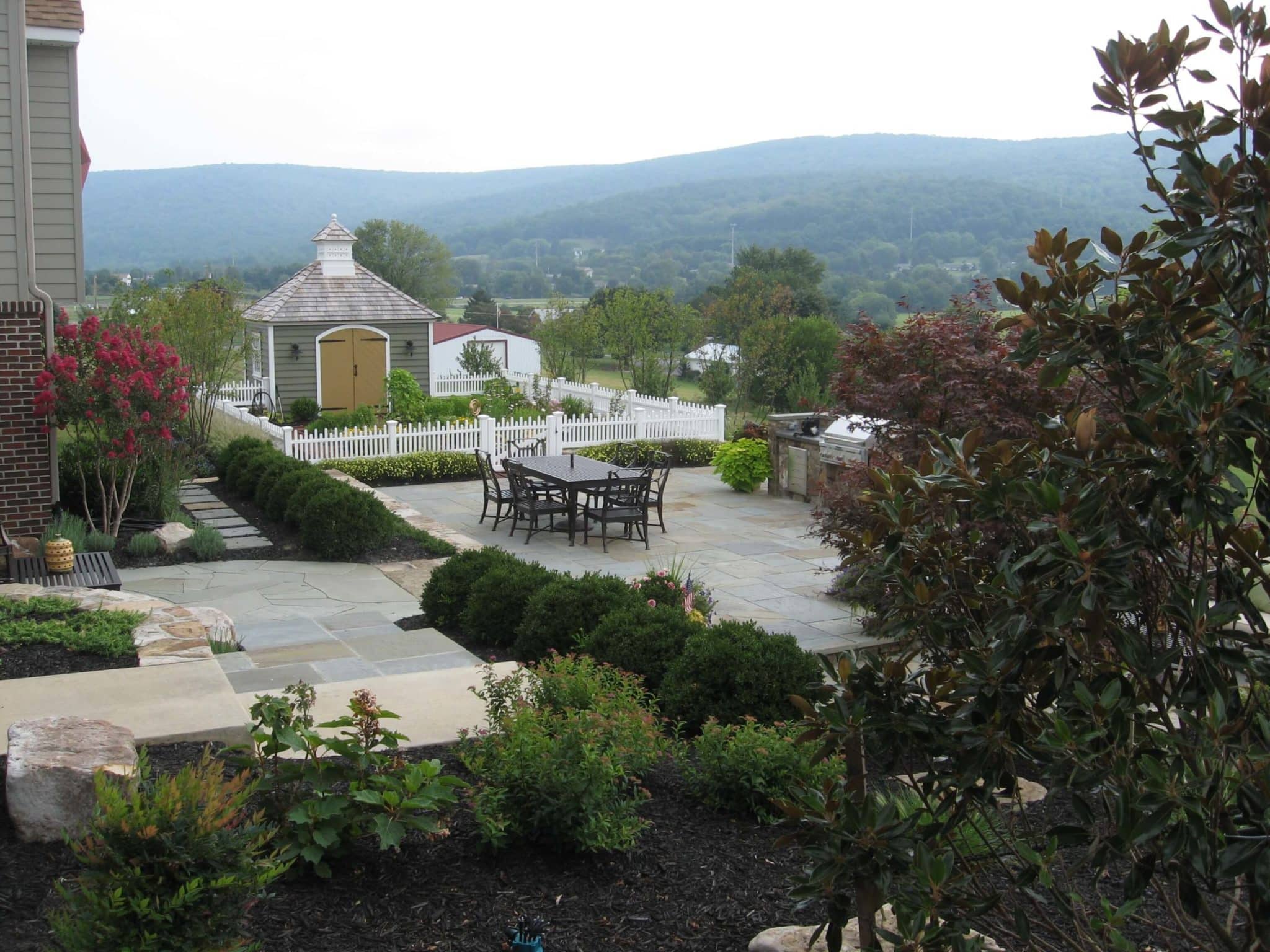 306 Formal Flagstone Patio with Stone Walls, Built In Grill, Boulders and Potager Garden