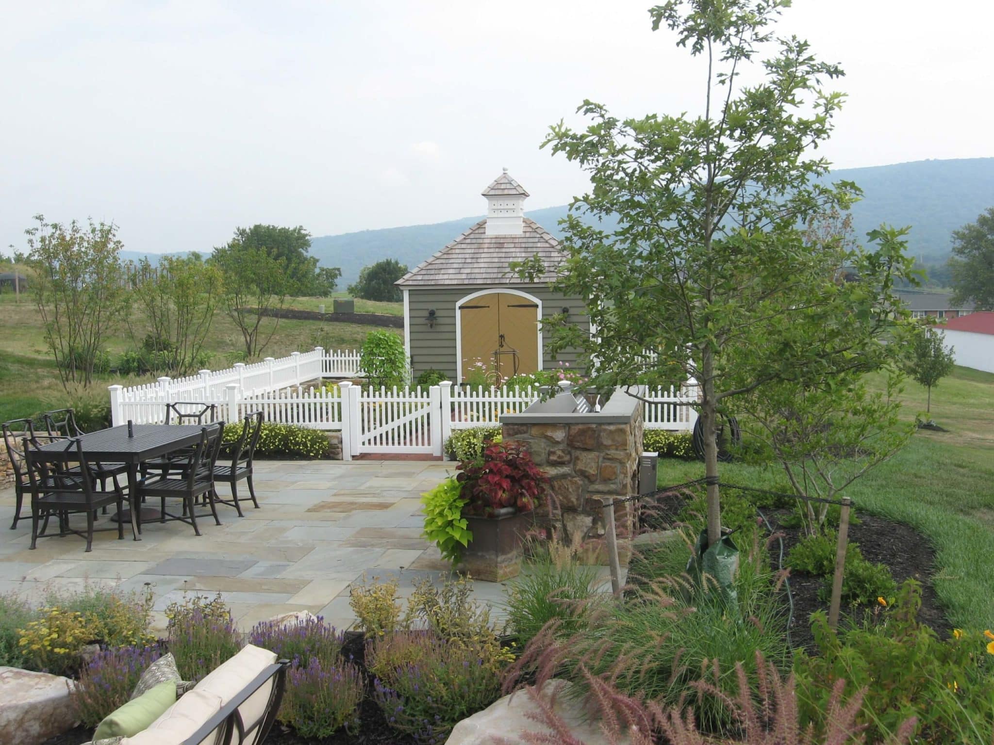 308 Formal Flagstone Patio with Stone Walls, Built In Grill, Boulders and Potager Garden