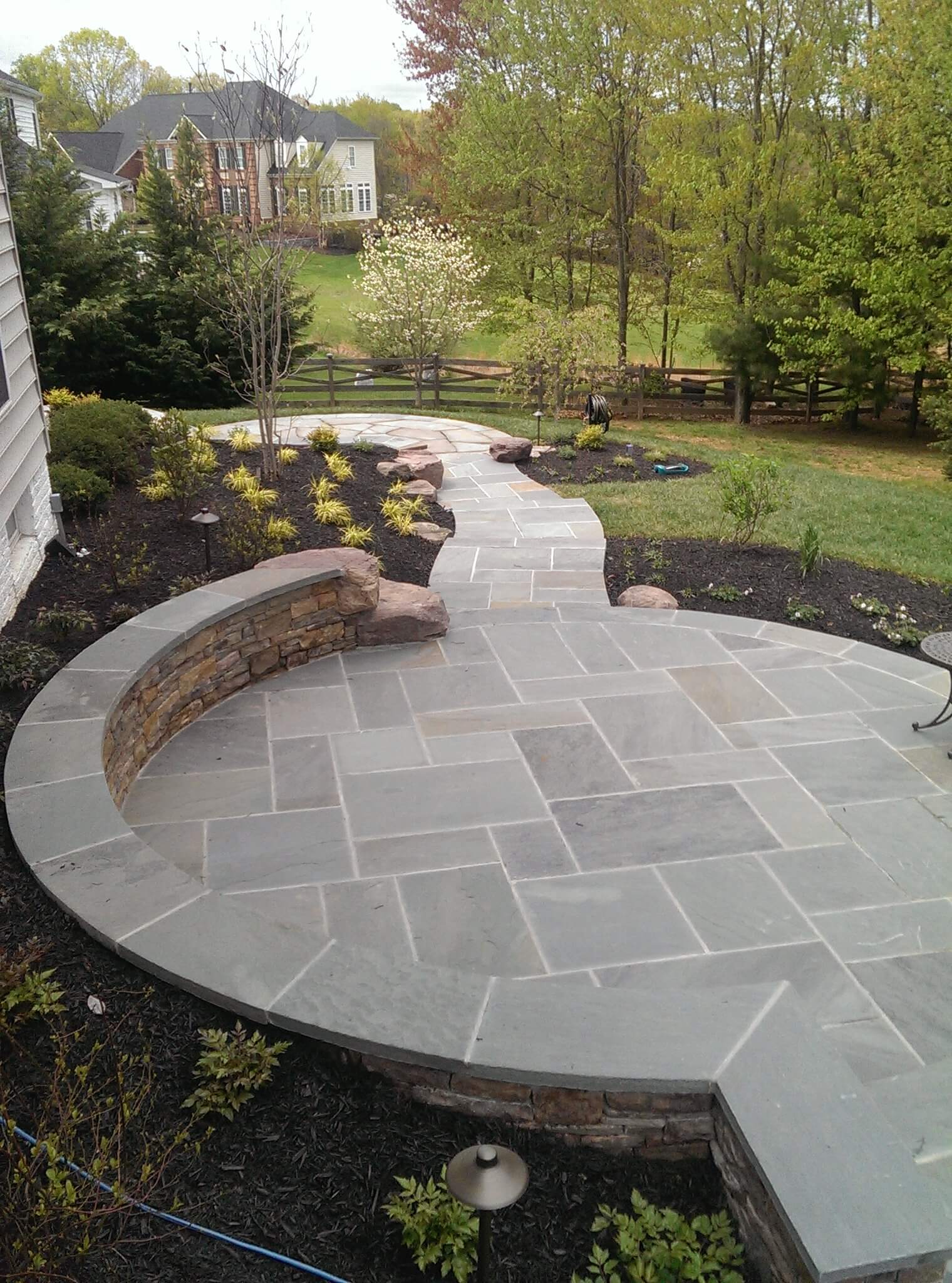 333 Circular Flagstone Patio with Flagstone Border and PA Beige Stone Sitting Wall with Flagstone Cap