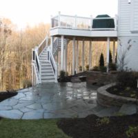 387 Lower Level Patio with Irregular Flagstone, Stone Retaining Wall and Water Feature