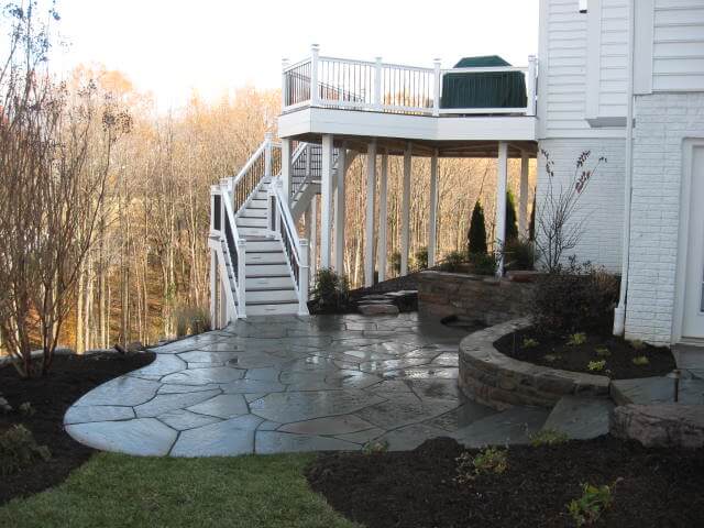 387 Lower Level Patio with Irregular Flagstone, Stone Retaining Wall and Water Feature
