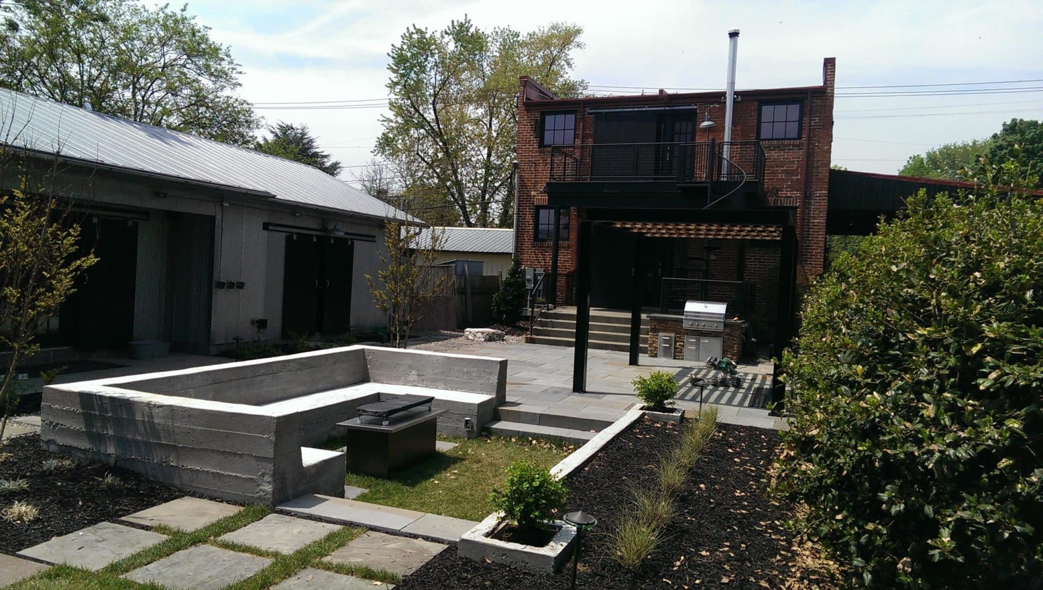 438 Urban Entertaining Space with Flagstone Patio, Custom Steel Pergola and Built-In Benches with Gas Fire Pit