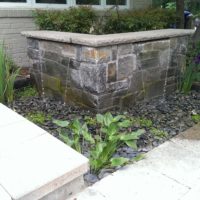 487 Cantilevered Stone Waterfall Wall at Front Entry