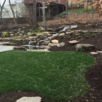 527 Hillside Landscape Features Boulders, Stone Walls and a Water Feature