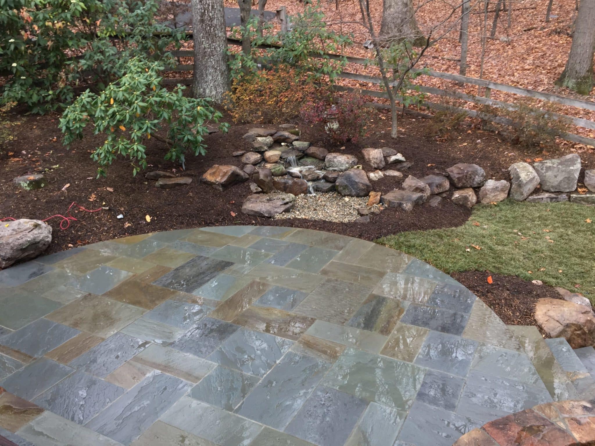 534 Flagstone Patio with Pondless Waterfall, Delaware Gravel and Boulders