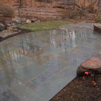 535 Flagstone Patio with PA Beige Stone Wall and Boulders