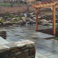 540 Flagstone Patio with Cedar Arbor and Waterfalls Built Into the Hillside