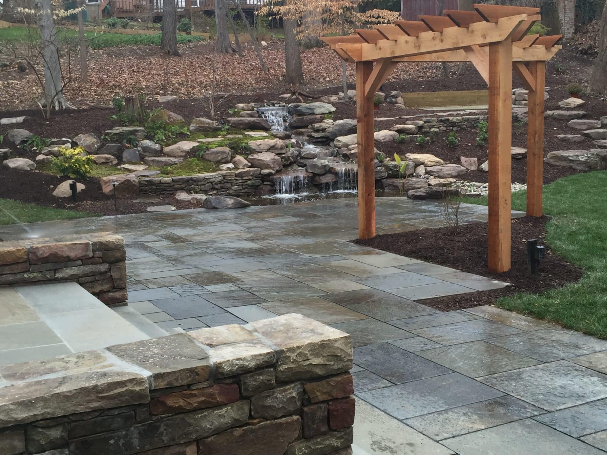 540 Flagstone Patio with Cedar Arbor and Waterfalls Built Into the Hillside