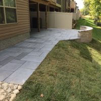 563 Townhouse Patio in Techo-Bloc Aberdeen Azzurro Pavers with Curvd Sitting & Retaining Wall