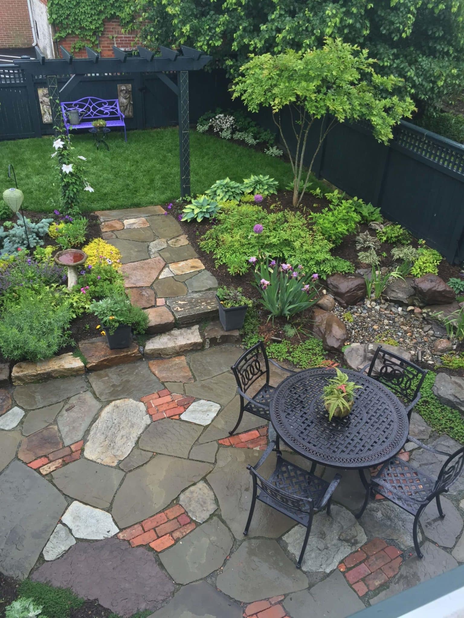 576 Informal Patio Featuring Irregular Flagstone, Salvaged Brick and Waterfeature