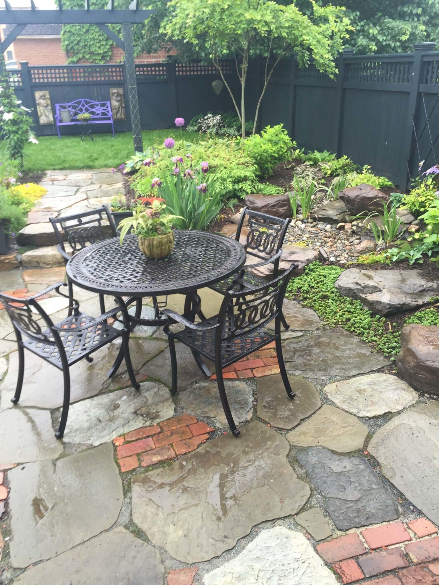 670 Informal Patio Featuring Irregular Flagstone, Salvaged Brick and Waterfeature