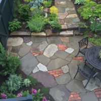 671 Informal Patio Featuring Irregular Flagstone and Salvaged Brick