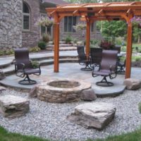 76 Round Stone Firepit at Edge of Flagstone Patio with Boulder Seats
