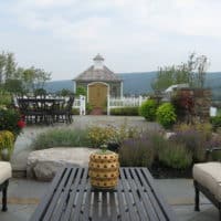 Formal Flagstone Patio with Stone Walls, Built In Grill, Boulders and Potager Garden 4