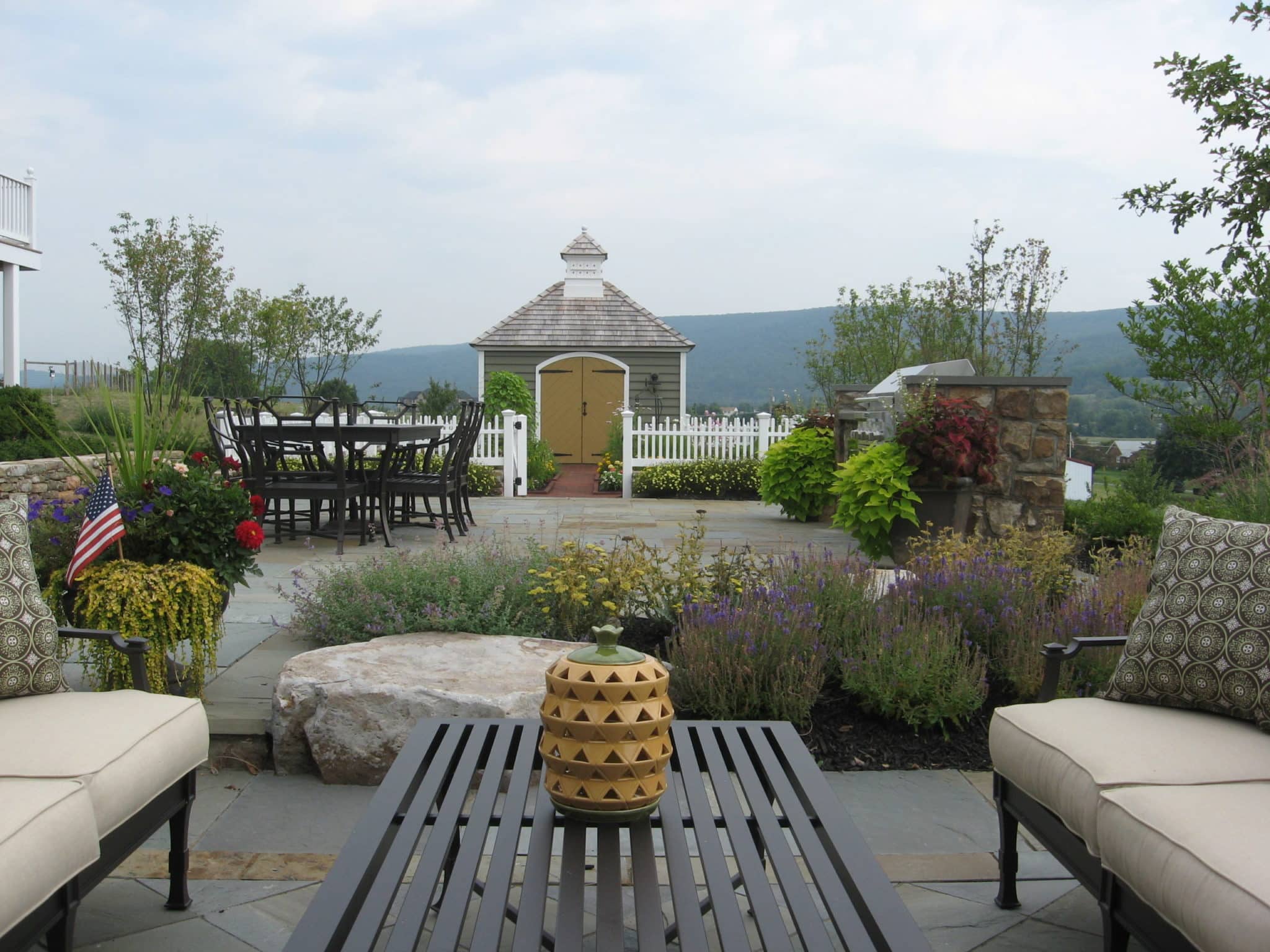 Formal Flagstone Patio with Stone Walls, Built In Grill, Boulders and Potager Garden 4