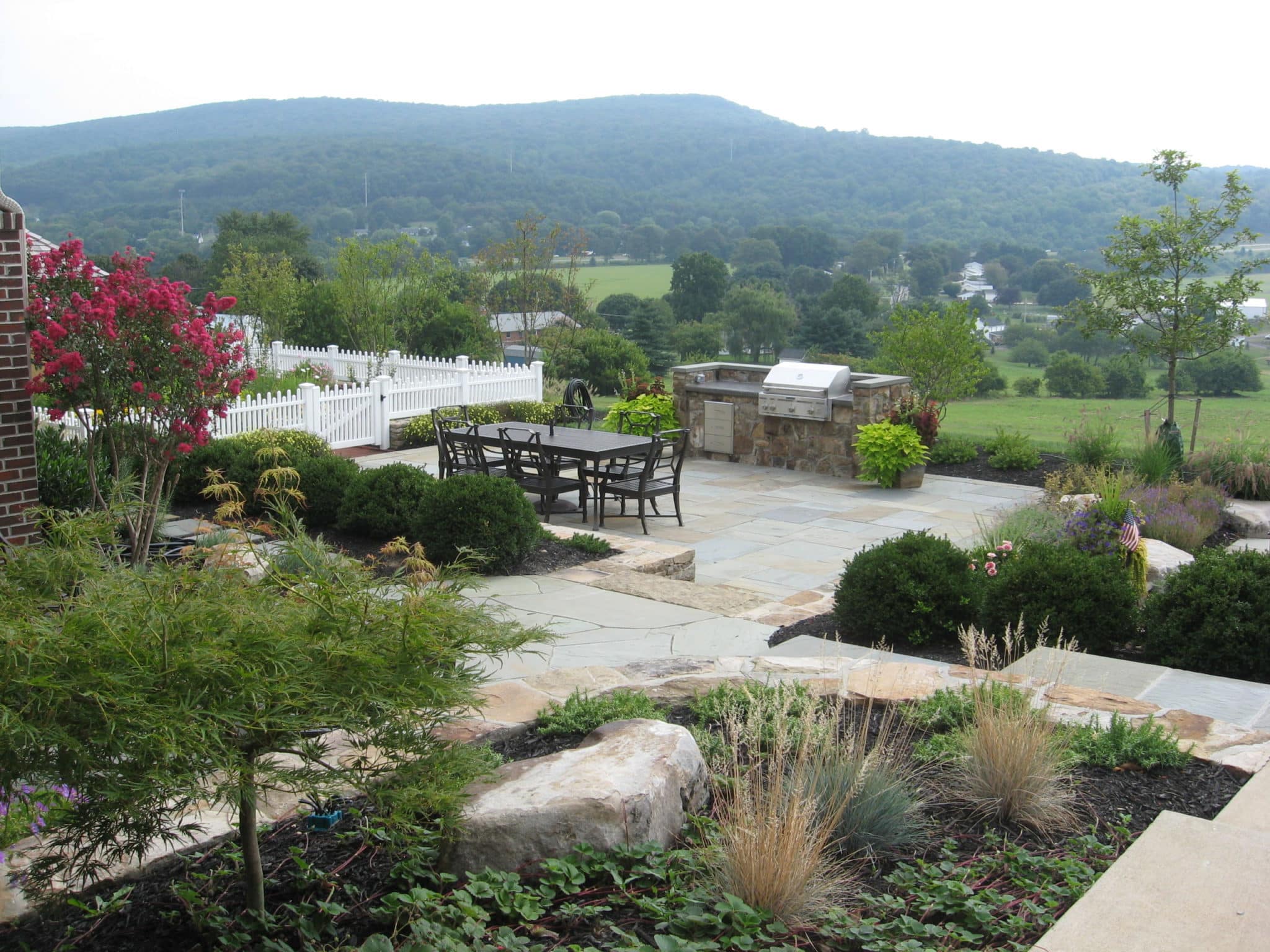 Formal Flagstone Patio with Stone Walls, Built In Grill, Boulders and Potager Garden 2