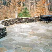 Flagstone Patio with Stone Wall