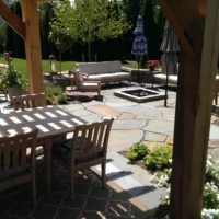 Flagstone Patio Shaded by Cedar Pergola